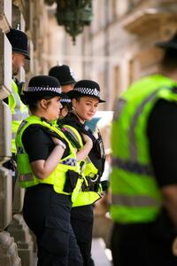Police officers on a city street. Photo by No Direction